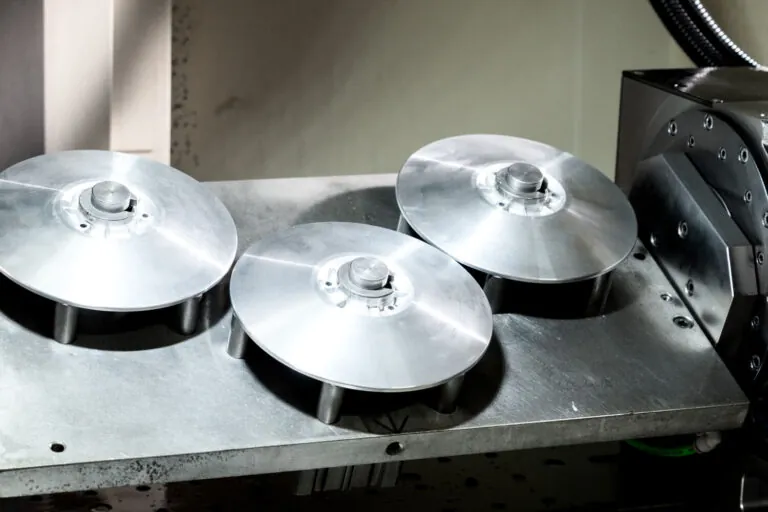 Precision-turned aluminum components showcasing fine surface finish and clean geometric profiles after CNC machining.