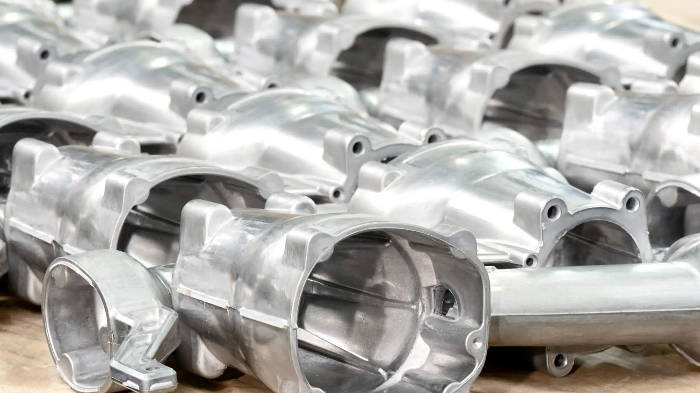 Batch of freshly cast aluminum Pneumatic Tools components showcasing consistent surface quality from an automated high-pressure die casting line.