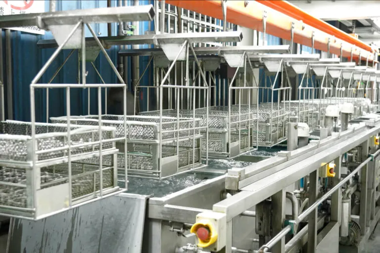 Automated industrial immersion tanks for electro coating and trivalent chromium treatment, ensuring uniform corrosion protection across complex aluminum geometries