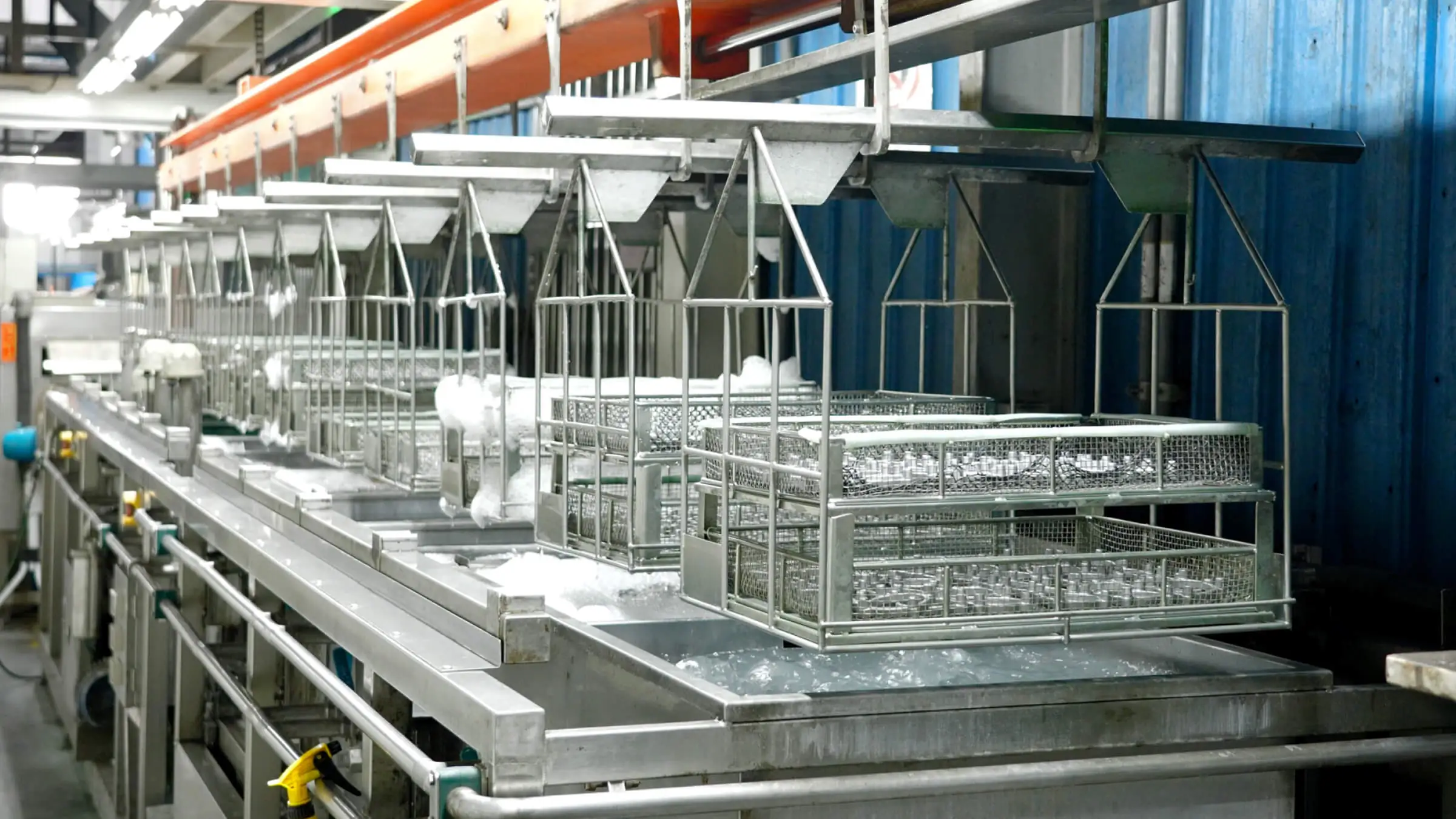 Fully automated surface treatment line at JoinCast’s Taiwan facility providing consistent chemical immersion and coating for aluminum die cast components.