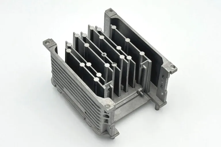 Aluminum die-cast ECU housing showcasing non-linear fin arrangements and integrated mounting bosses achieved through precision mold engineering.
