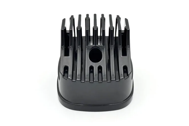 Detailed view of a black finished aluminum die casting with integrated cooling fins designed for high-performance thermal management.